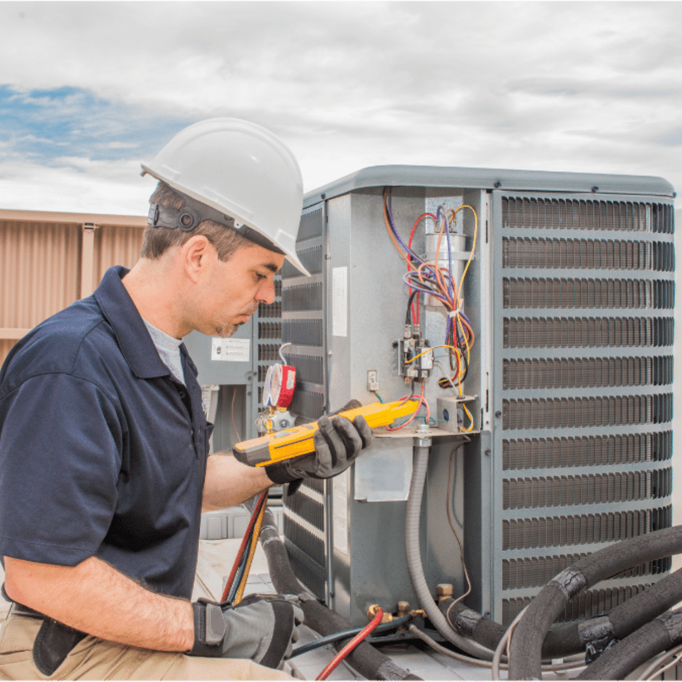 Cambridge HVAC Pros HVAC technician servicing a system