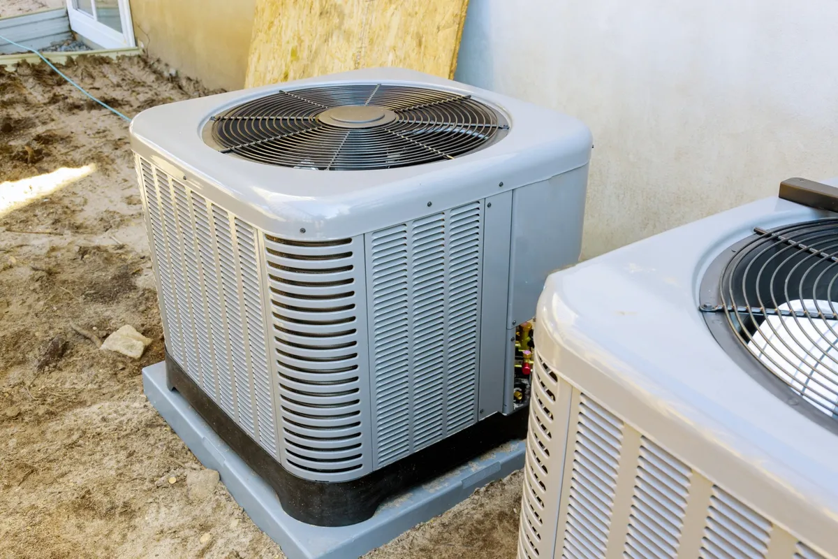 Two outdoor air conditioner condensers